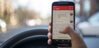 Person Driving With Phone