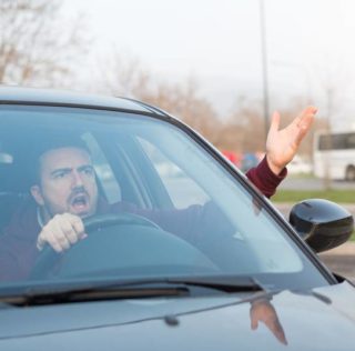 Driver in car with road rage