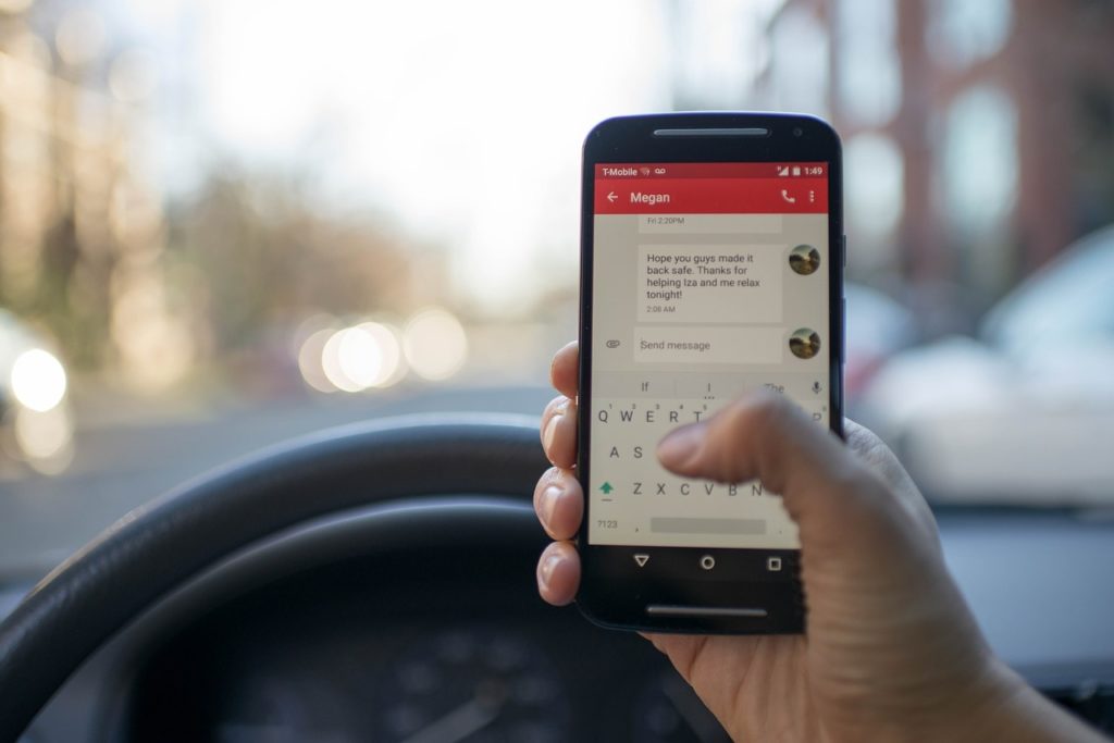 Person Driving With Phone