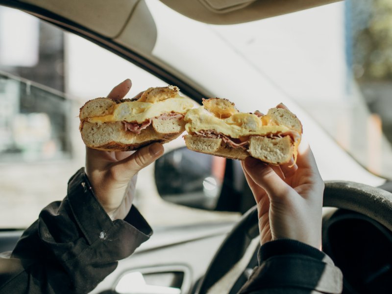 eating bagel while driving